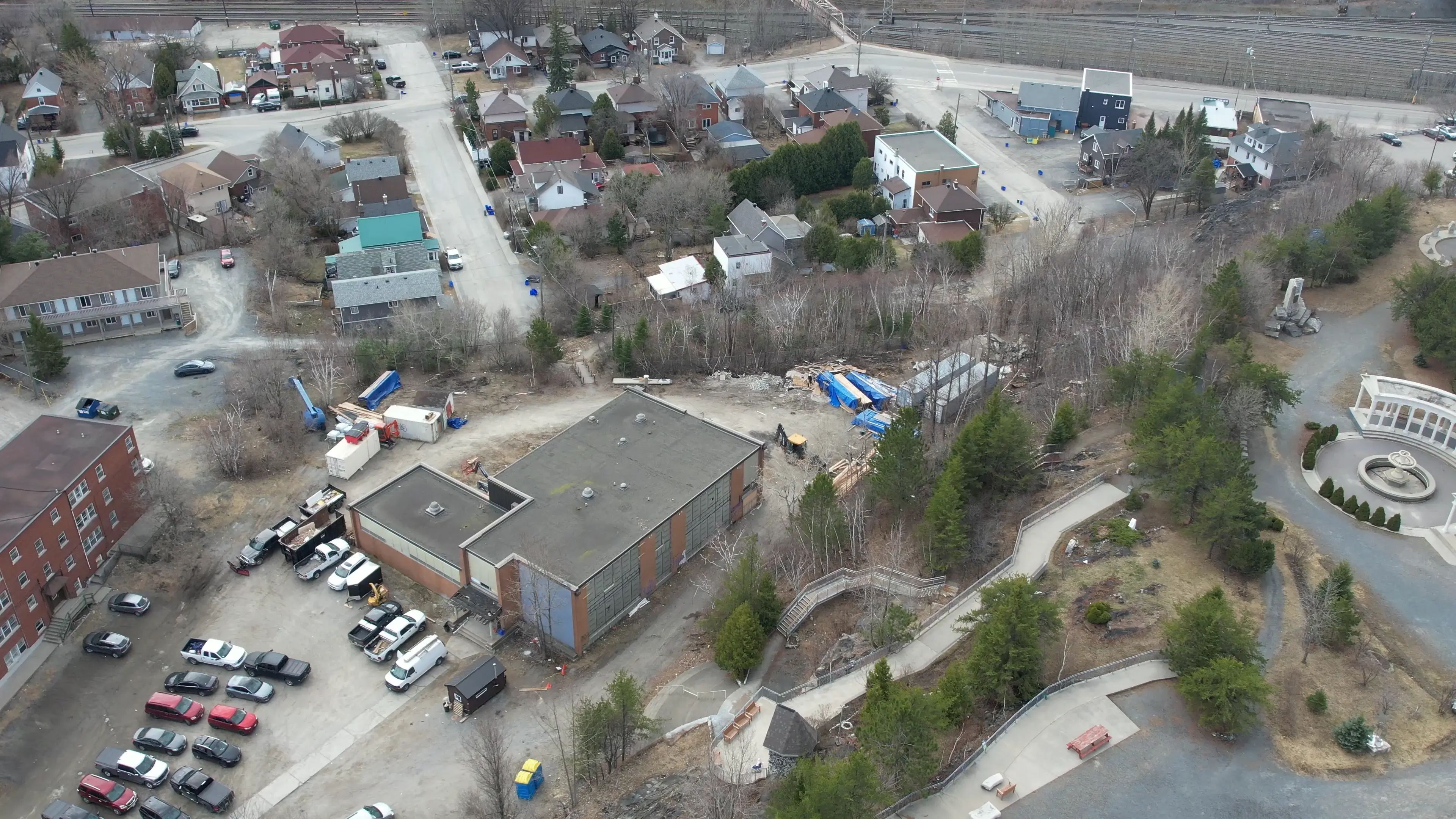 Aerial view of a community facility, parking areas, and surrounding neighbourhood.