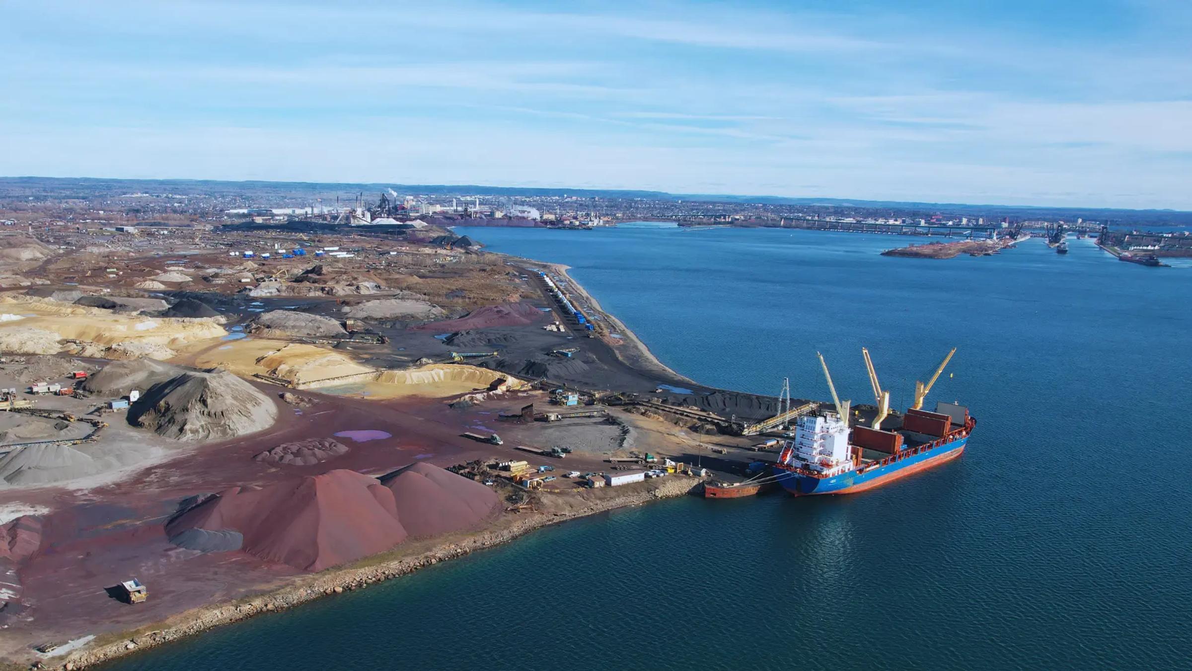 Aerial view of an ASI industrial site and shoreline.