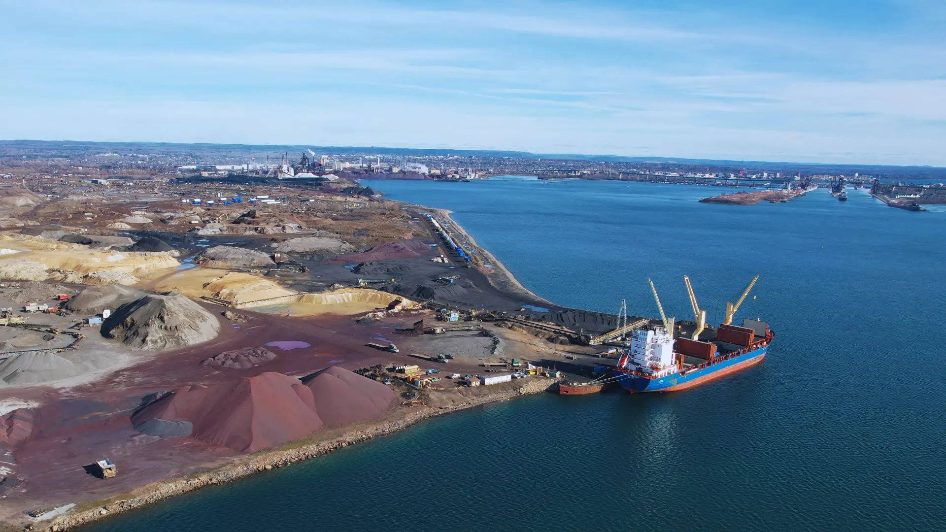 Aerial view of an ASI industrial site and shoreline.