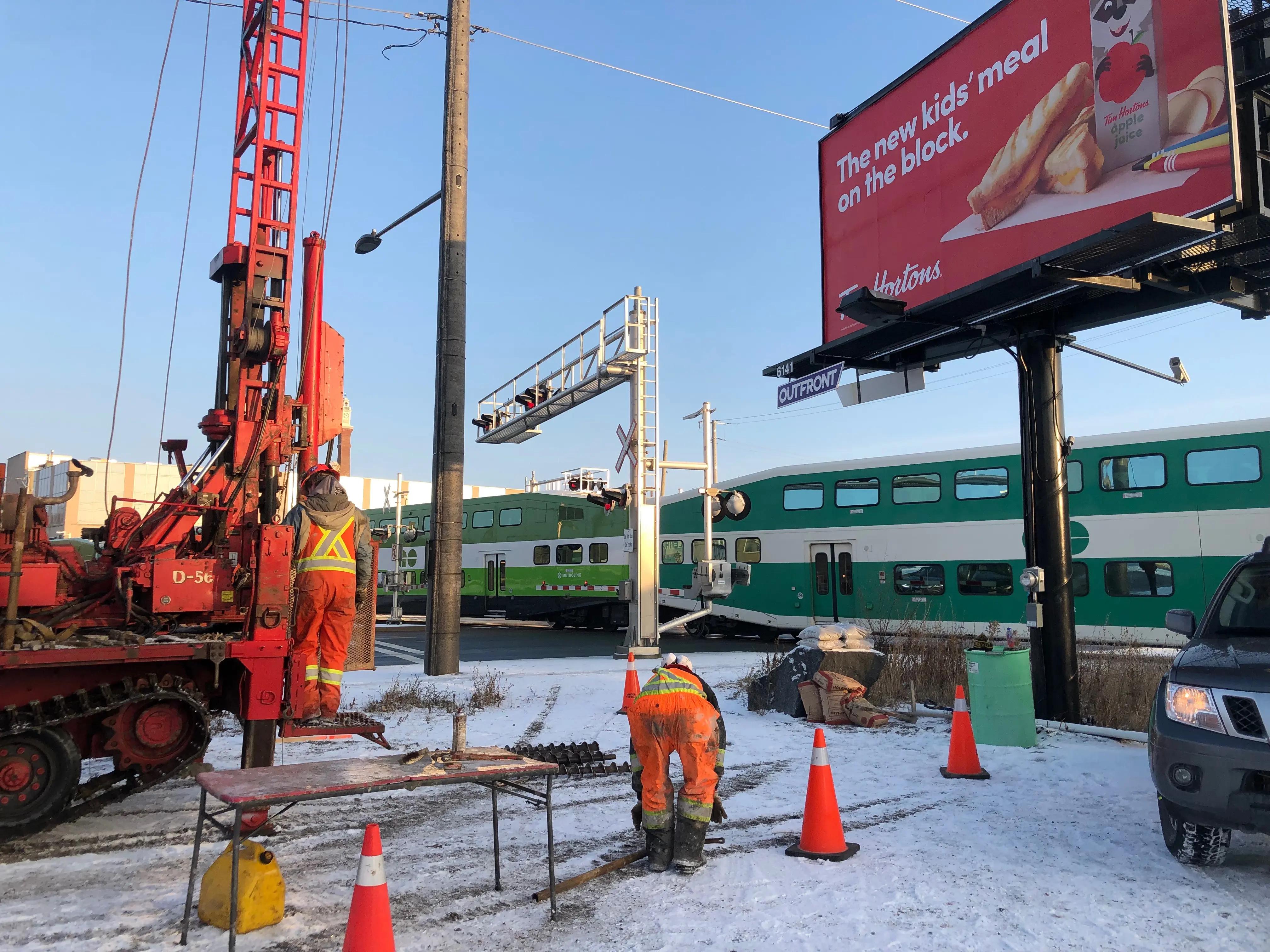 Geotechnical drilling and field work beside a Metrolinx rail corridor in Newmarket.