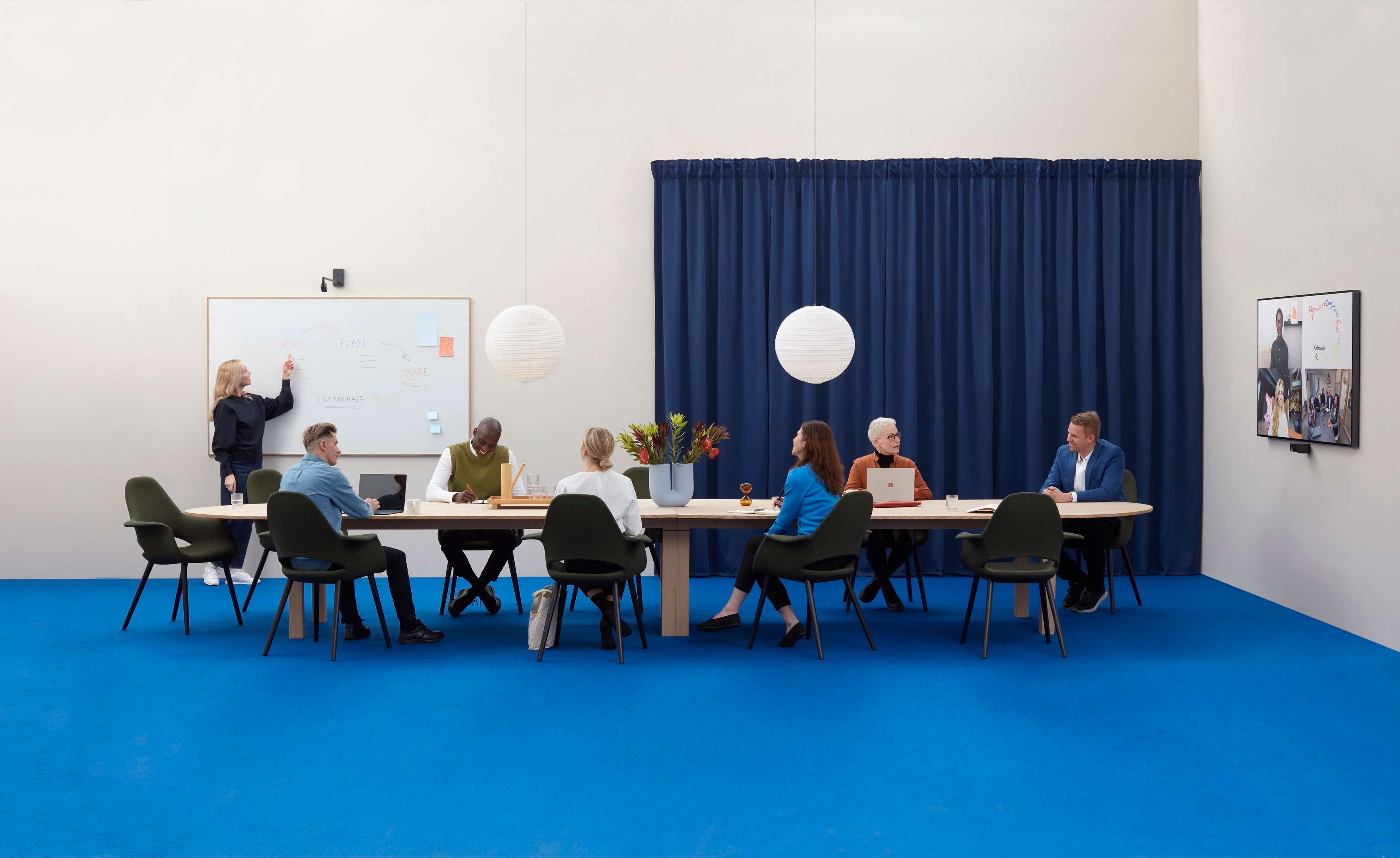 Large meeting room showing Huddly Canvas whiteboard camera and the Huddly L1