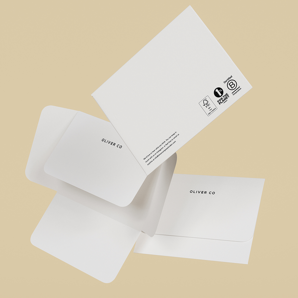 Floating 3D model of three white custom envelopes.