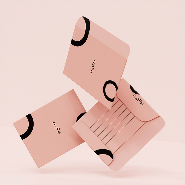 Floating 3D model of three pink custom envelopes.