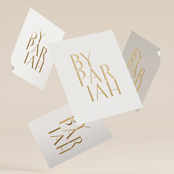 Floating 3D model of four white and gold custom stickers.