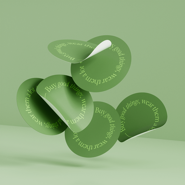 Floating 3D model of six green custom stickers.