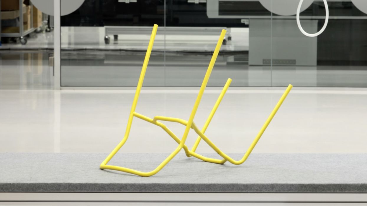Hale Chair steel frame in yellow on a production table in the De Vorm factory