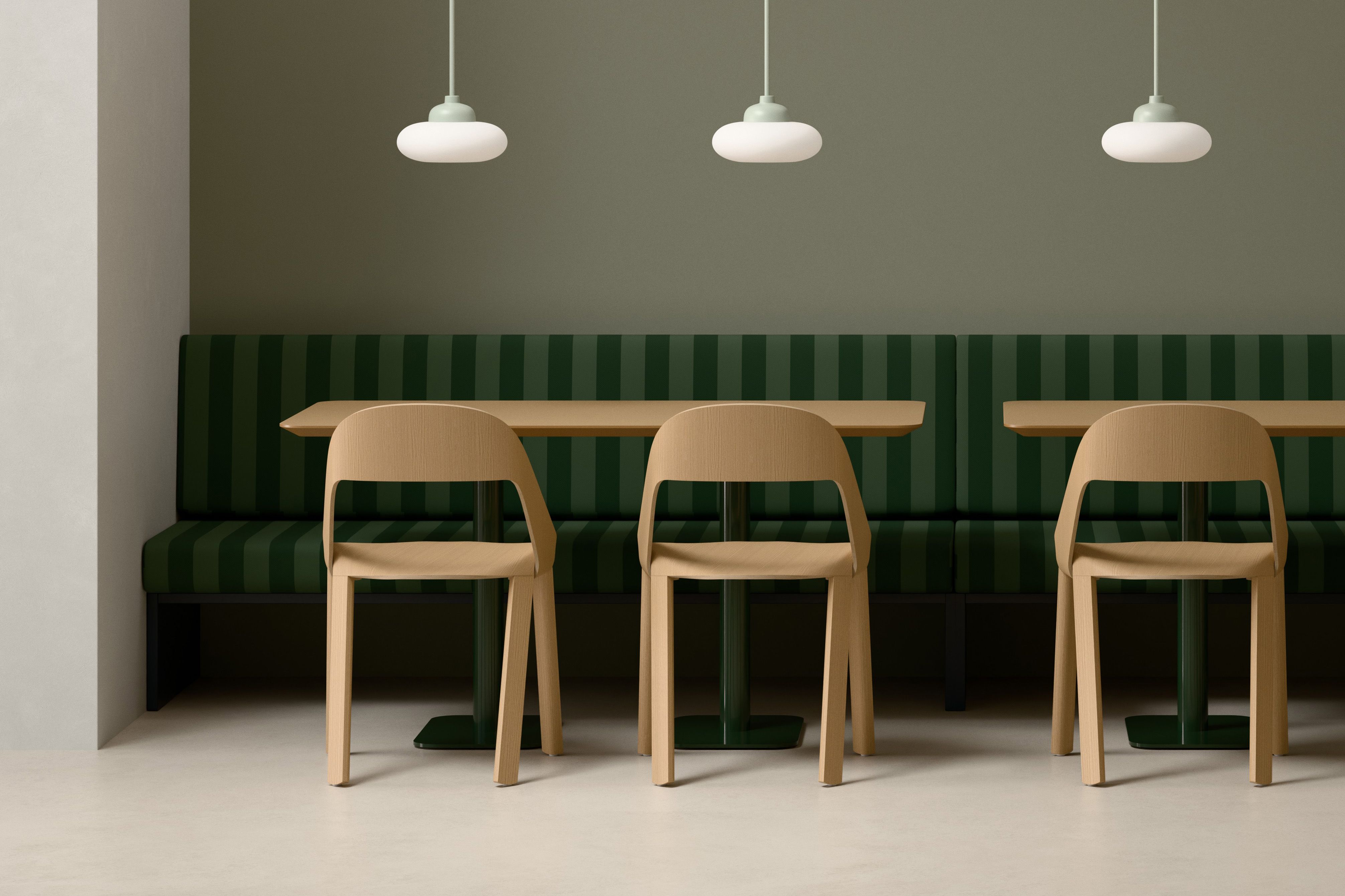 Split Round Orbit Pendant Lamps above a wooden table in a hospitality setting
