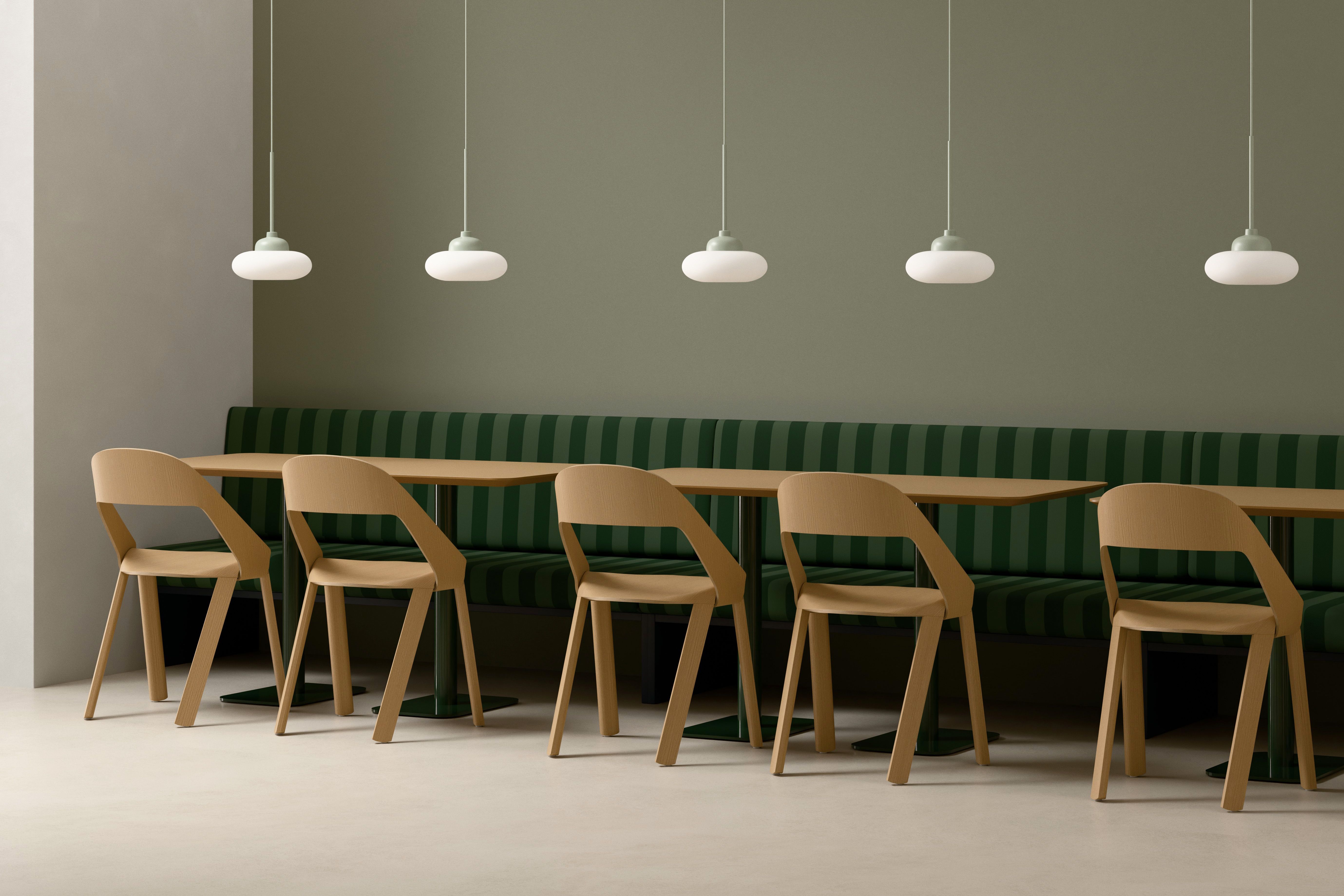Split Round Orbit Pendant Lamps above a bench seat in a hospitality setting