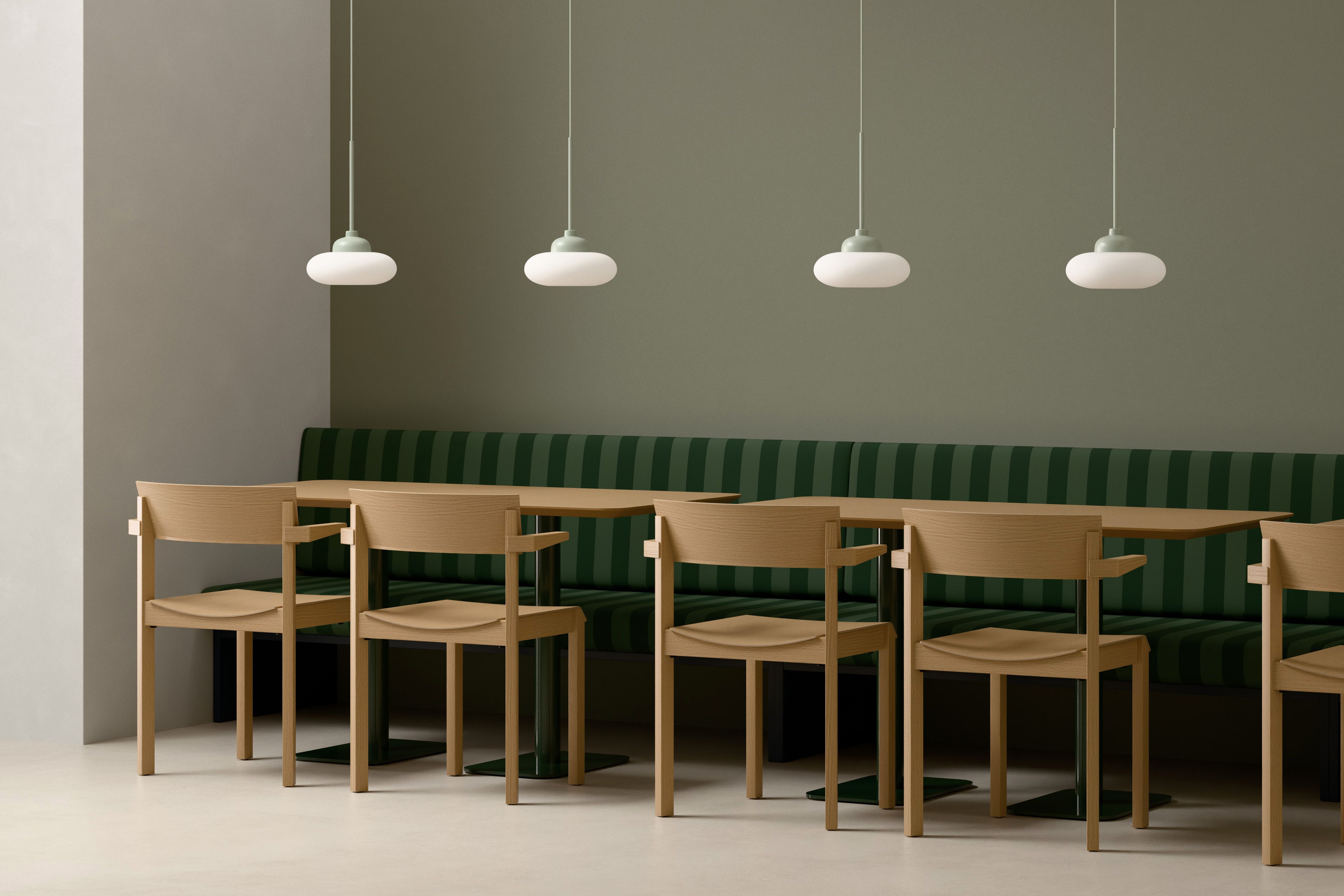 Split Round Orbit Pendant Lamps above a bench seat in a hospitality setting