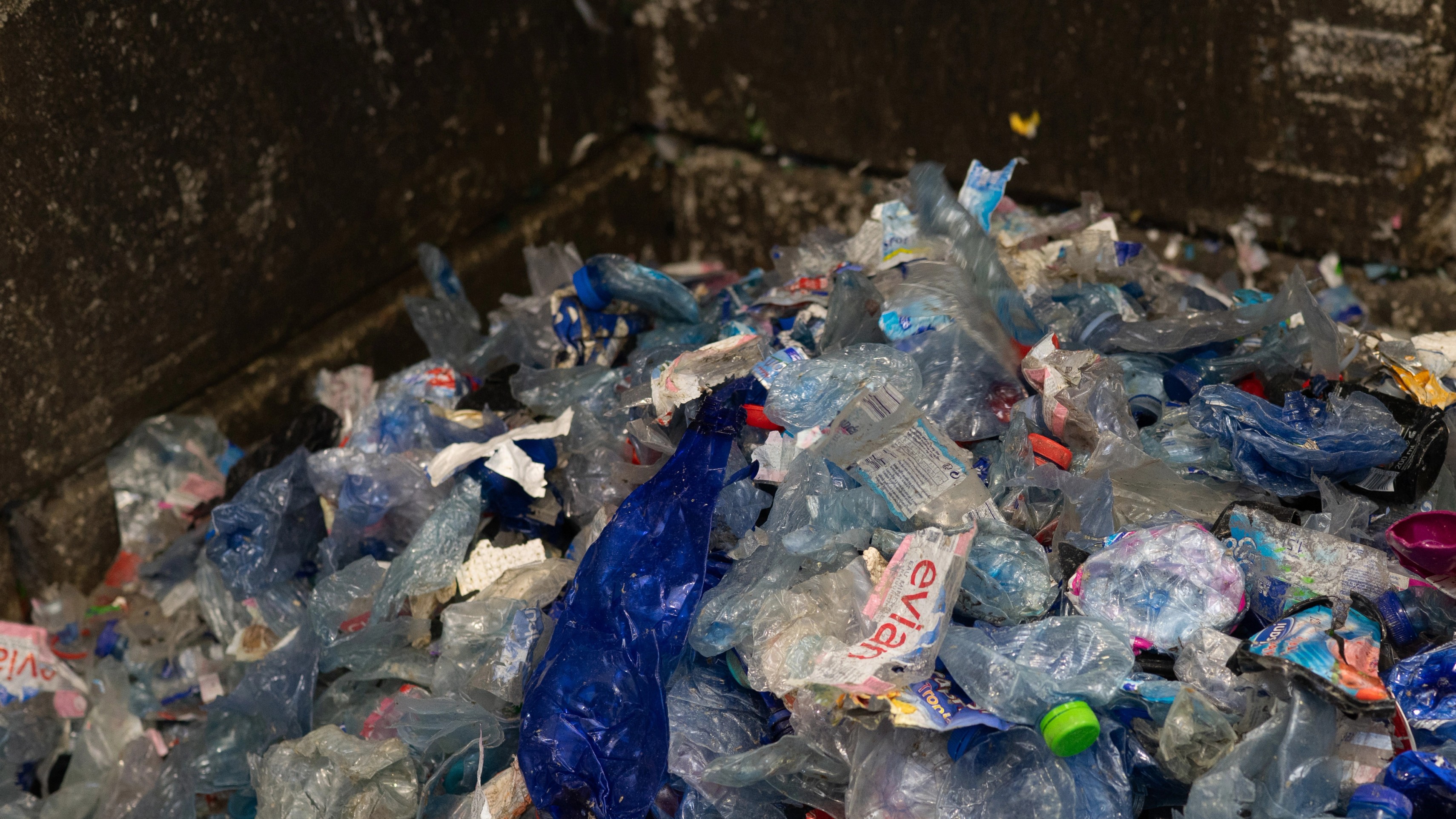 Loose plastic bottles and waste collected at a recycling centre, the first step in De Vorm PET felt production
