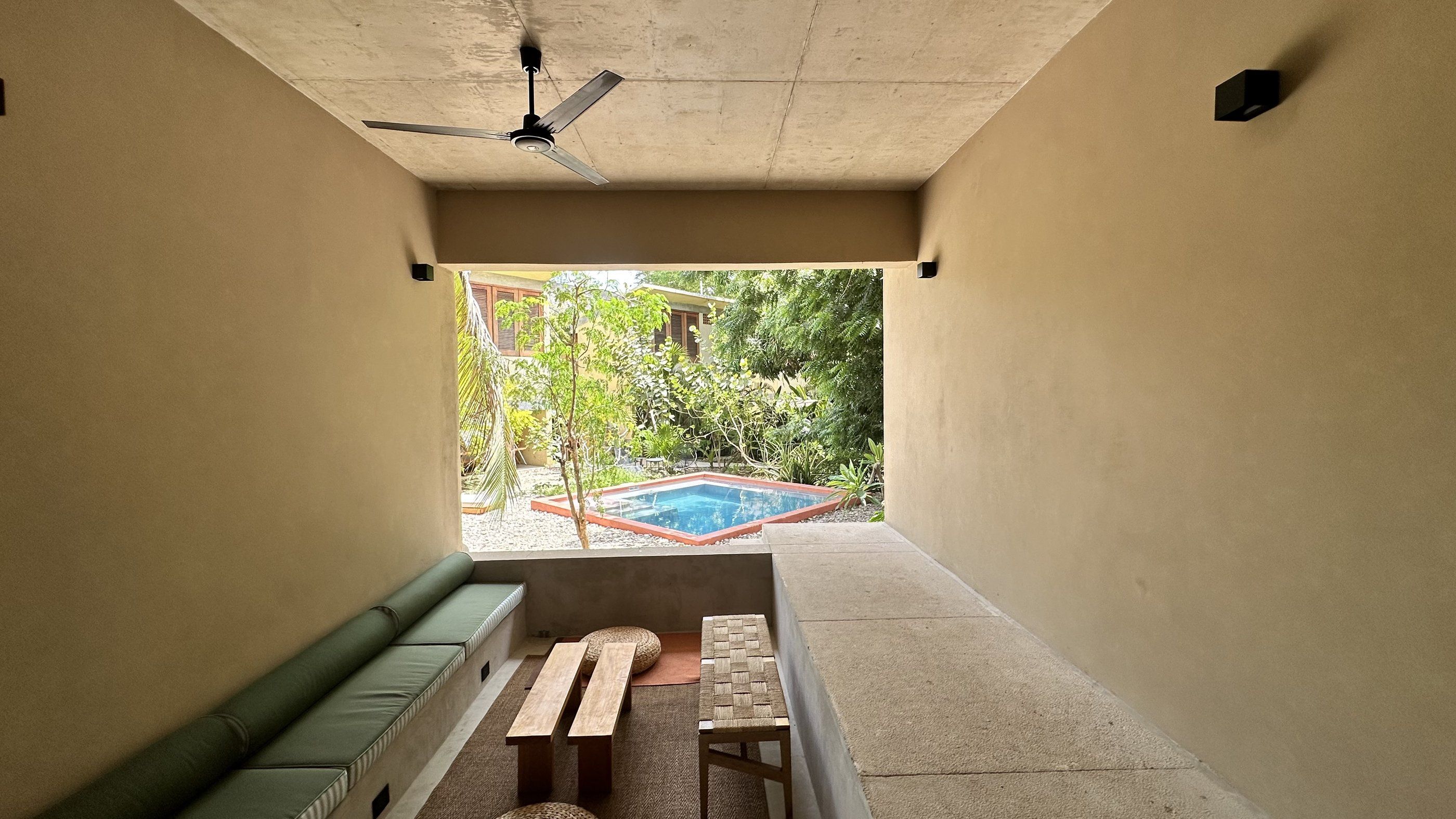 Covered lounge overlooking the pool