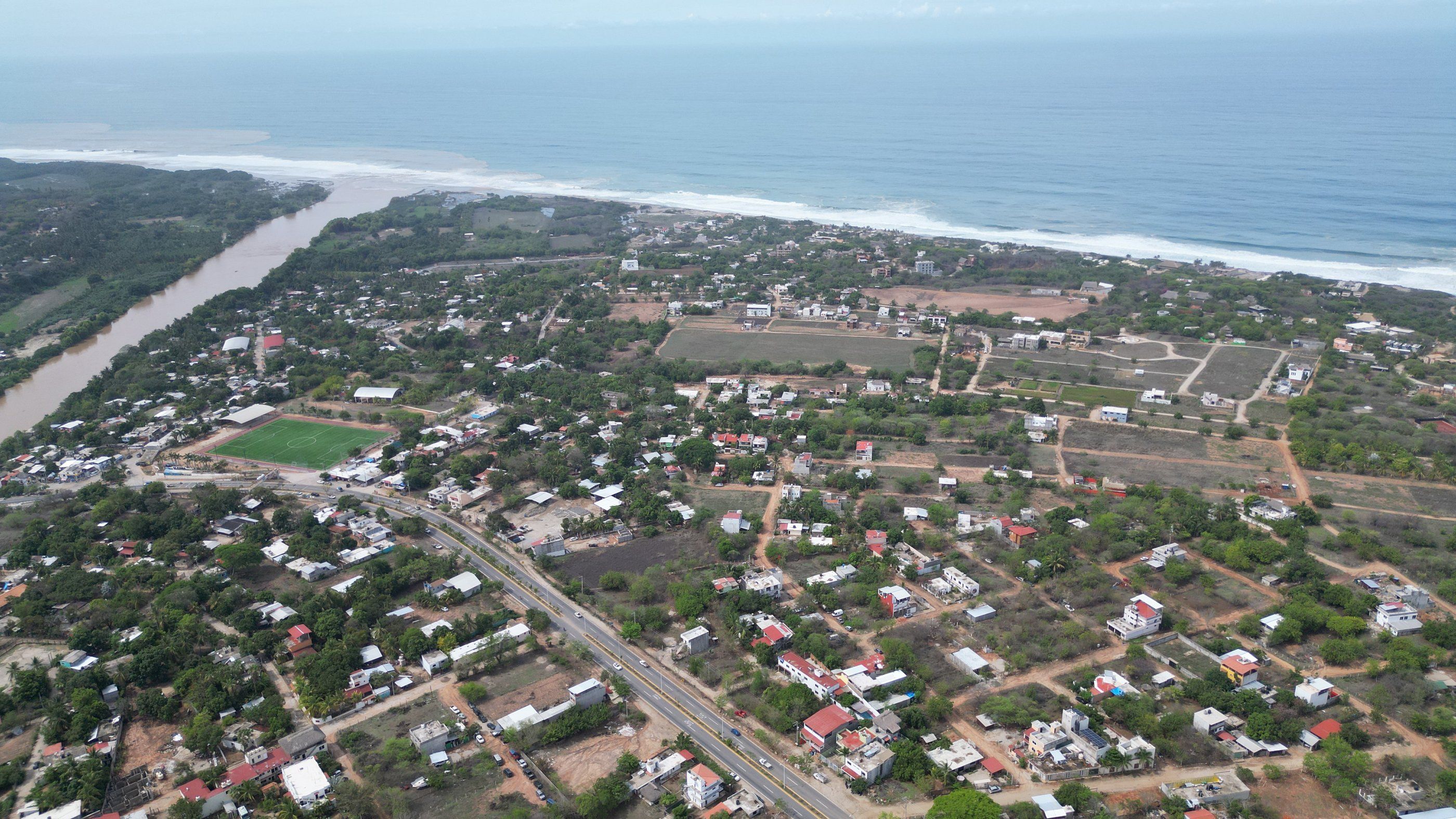 Aerial view of La Barra de Colotepec, the river mouth and the beach