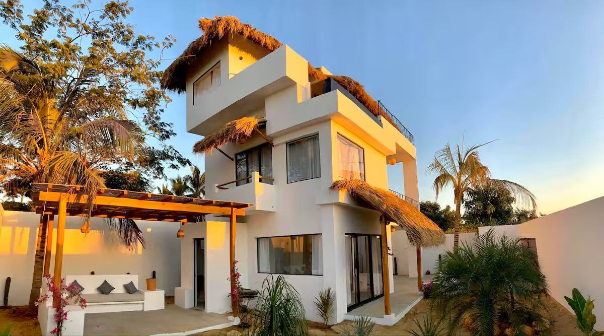 Exterior of the house with palapa roofs, Casa June, La Punta Zicatela