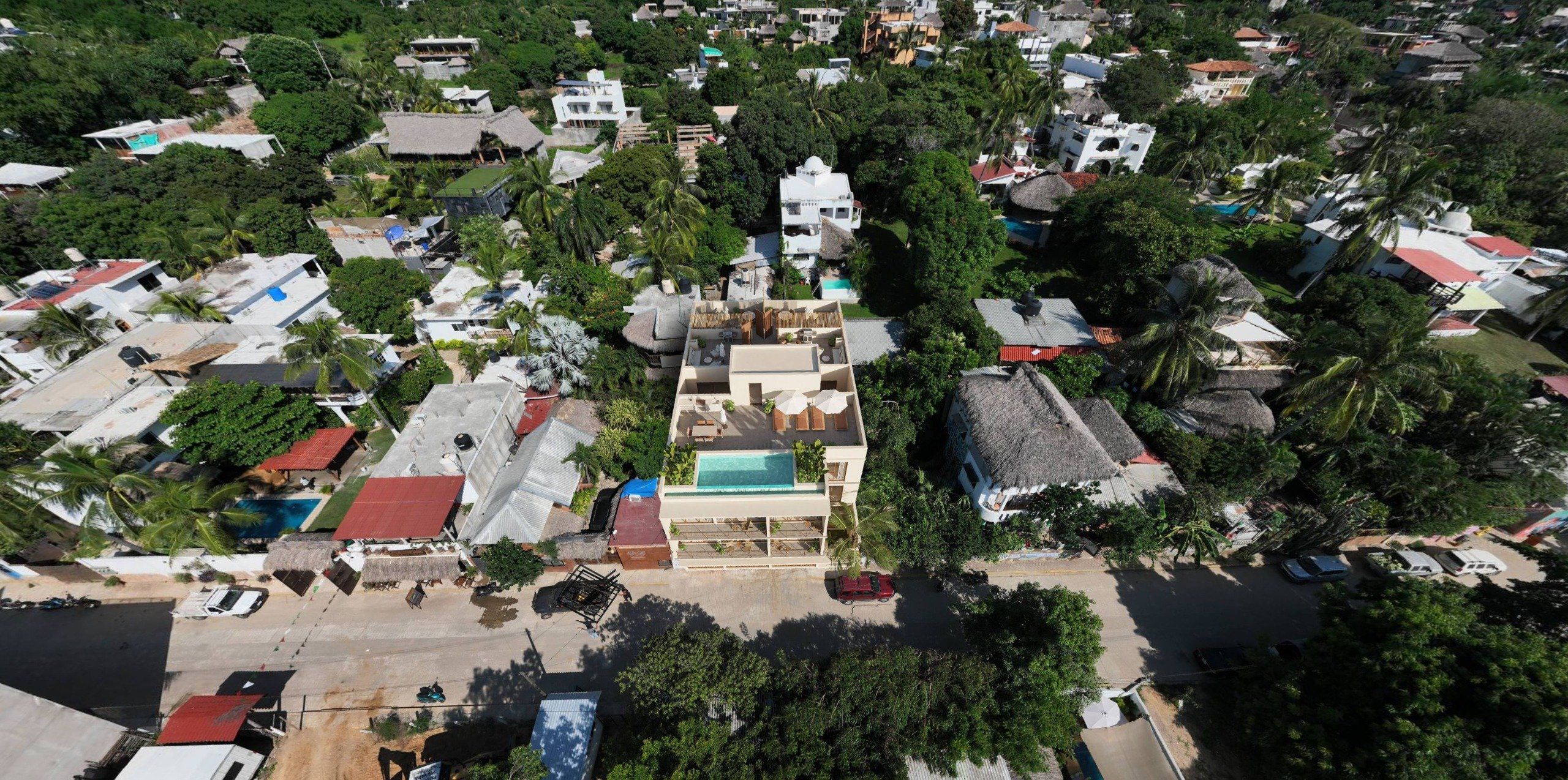 Aerial view of One Coast with rooftop pool, La Punta