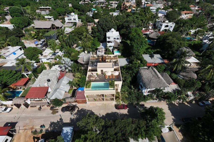 Aerial view of One Coast with rooftop pool, La Punta