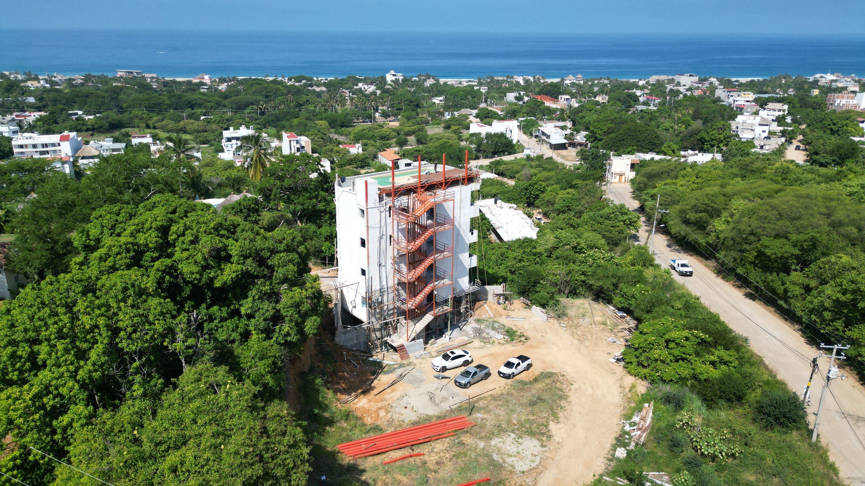 Drone view of Tower 1 with the ocean on the horizon, ZUL Residences, Emiliano Zapata