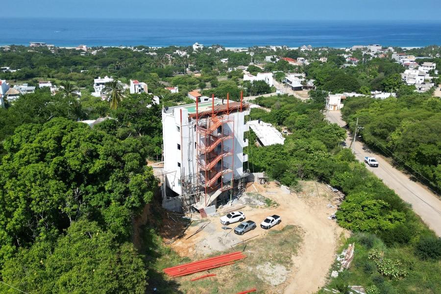 Drone view of Tower 1 with the ocean on the horizon, ZUL Residences, Emiliano Zapata