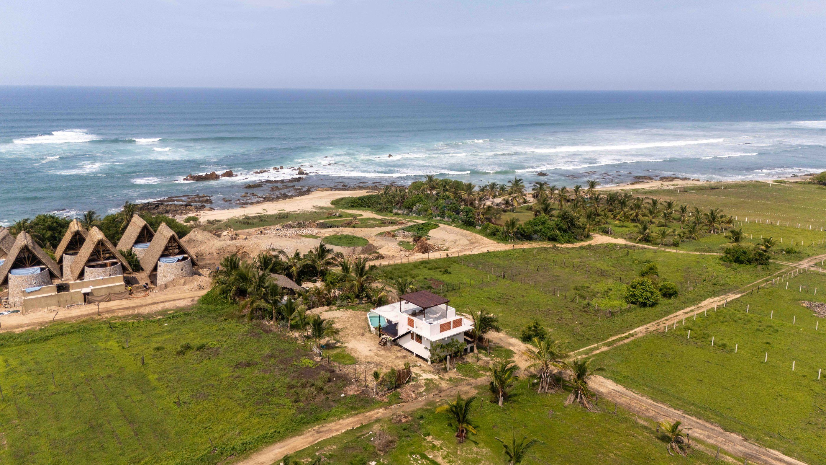 Aerial view of the house and the nearby coastline, El Puertecito