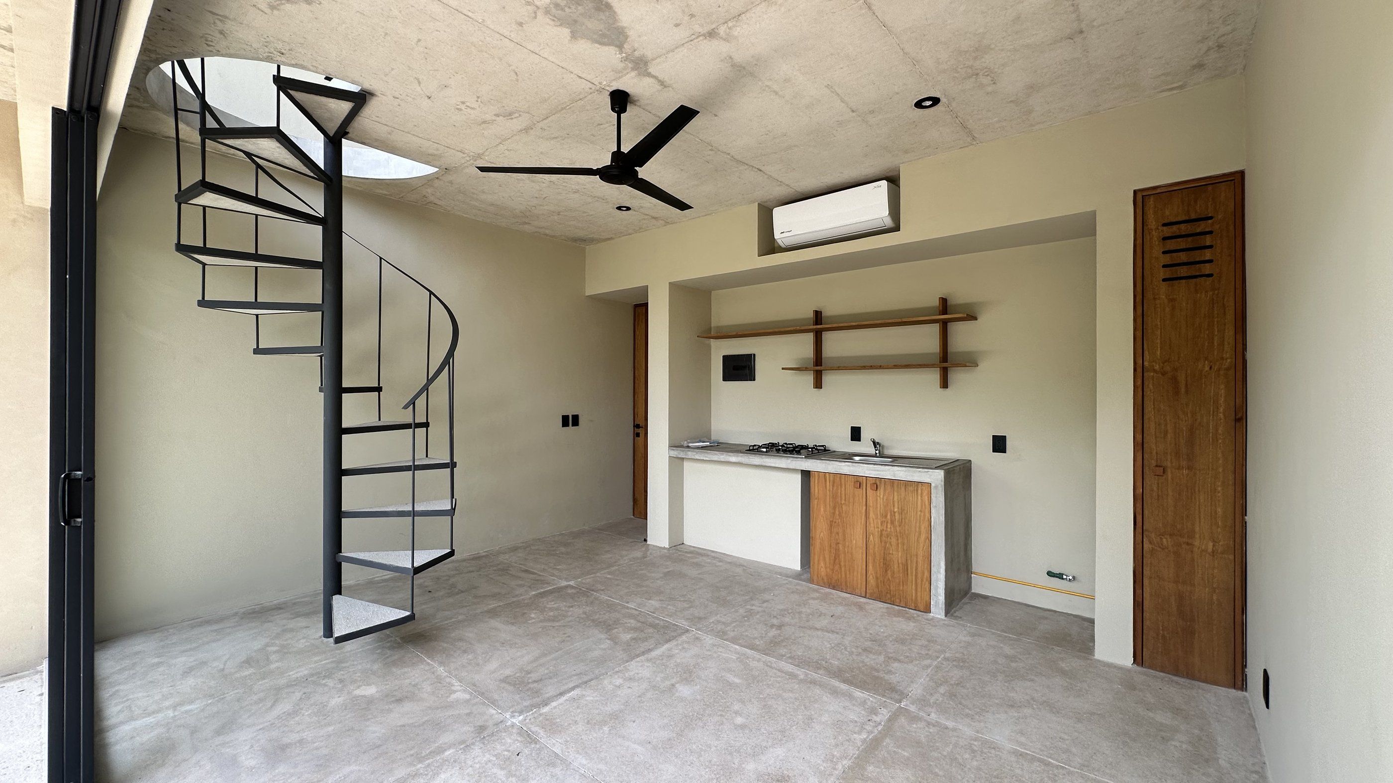 Kitchenette and spiral staircase