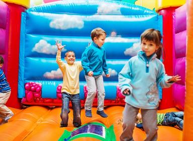 Kids jumping in a bouncy castle