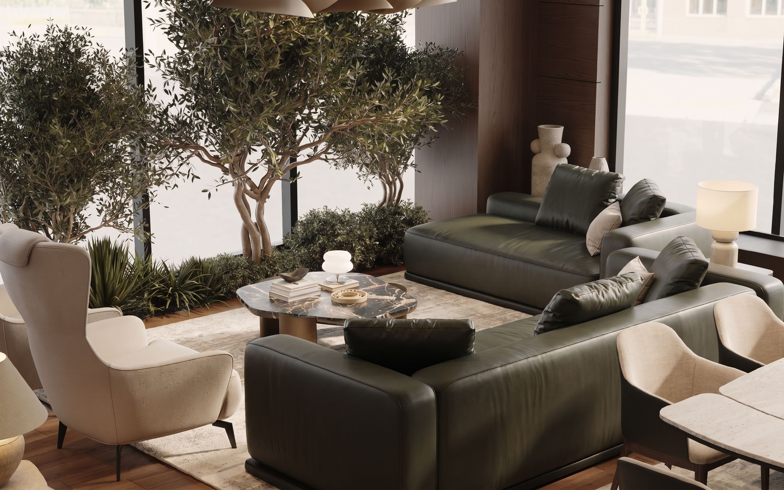 Lounge furniture arranged around a garden courtyard in soft stone