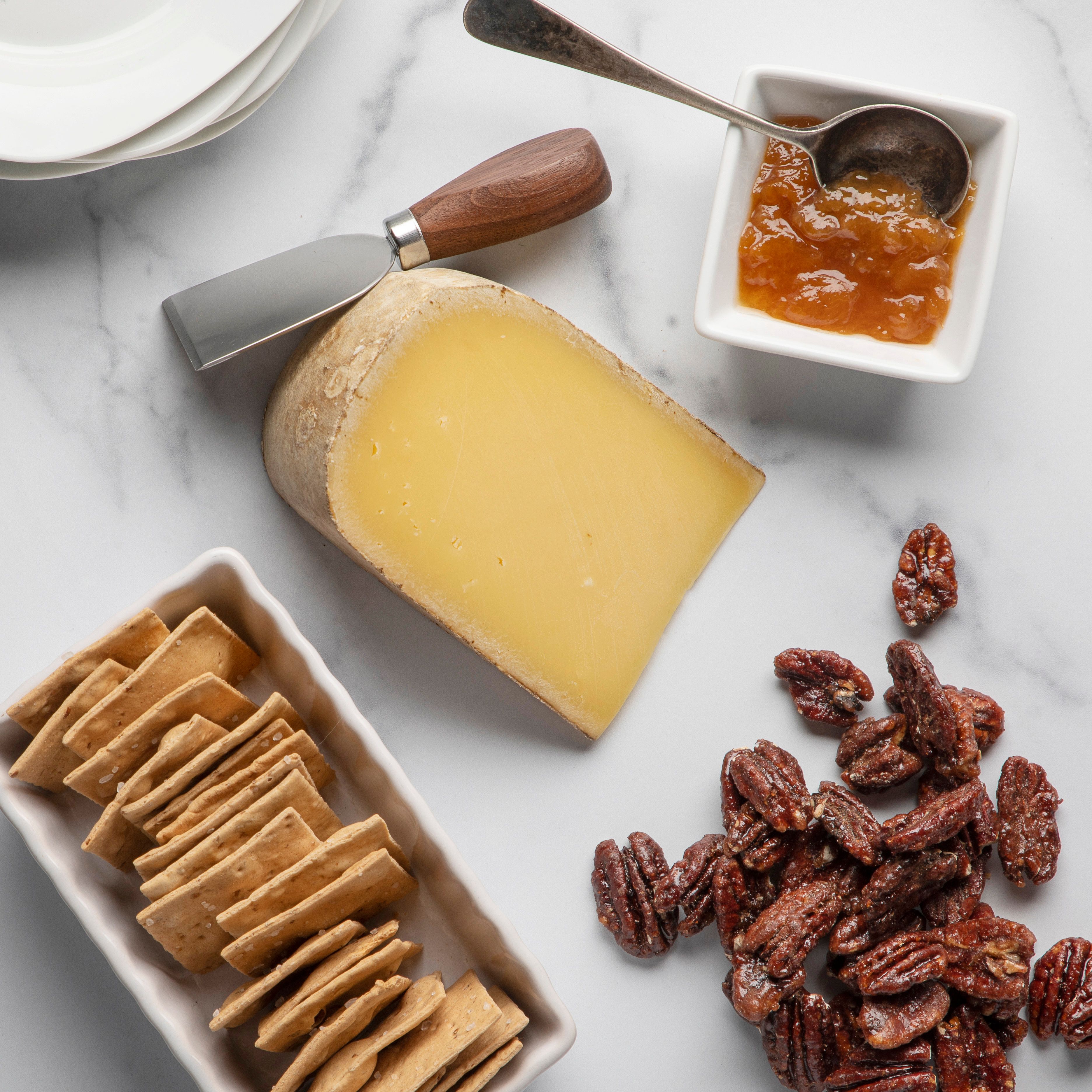 Pleasant Ridge Reserve with crackers, jam and pecans