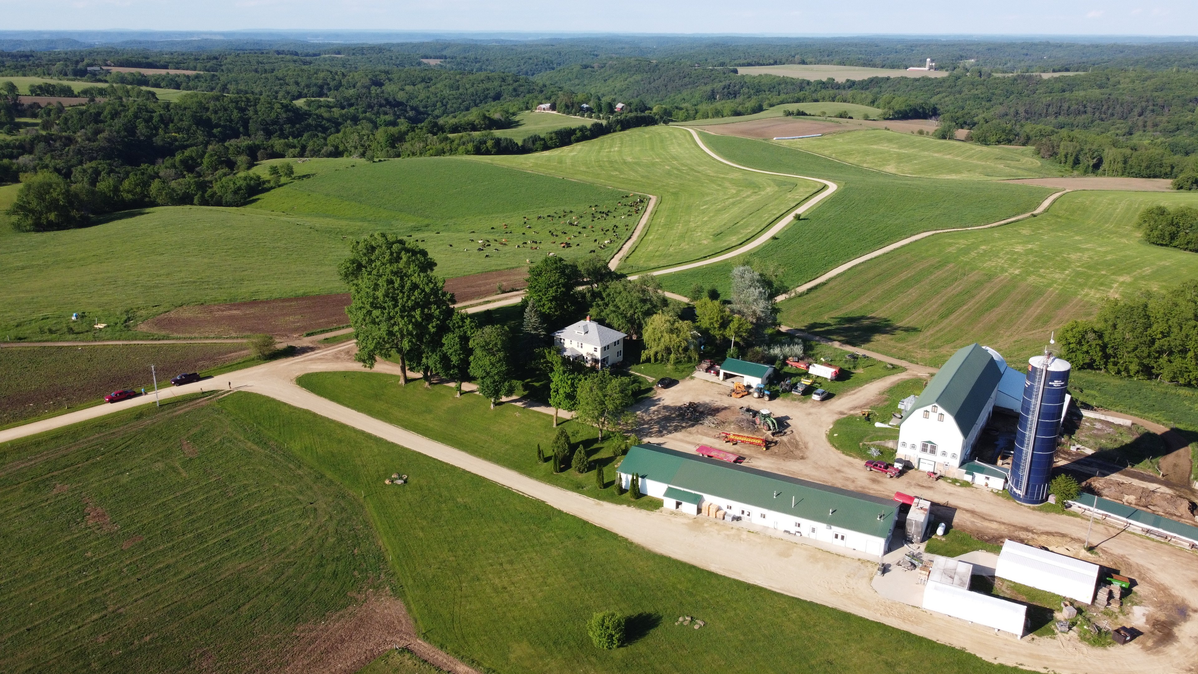 Aerial view of the farm and surrounding pasture