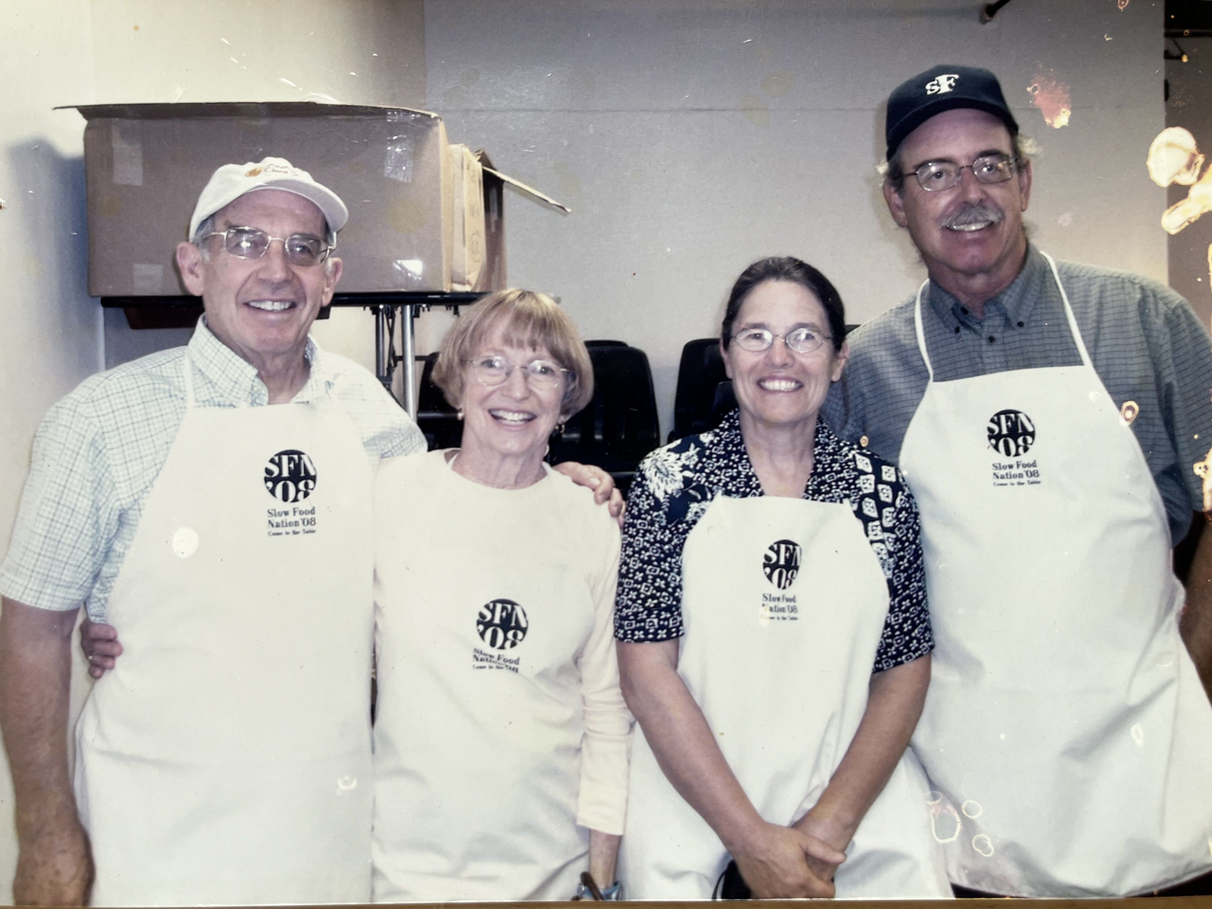 The Gingrich and Patenaude families in their cheesemaking aprons