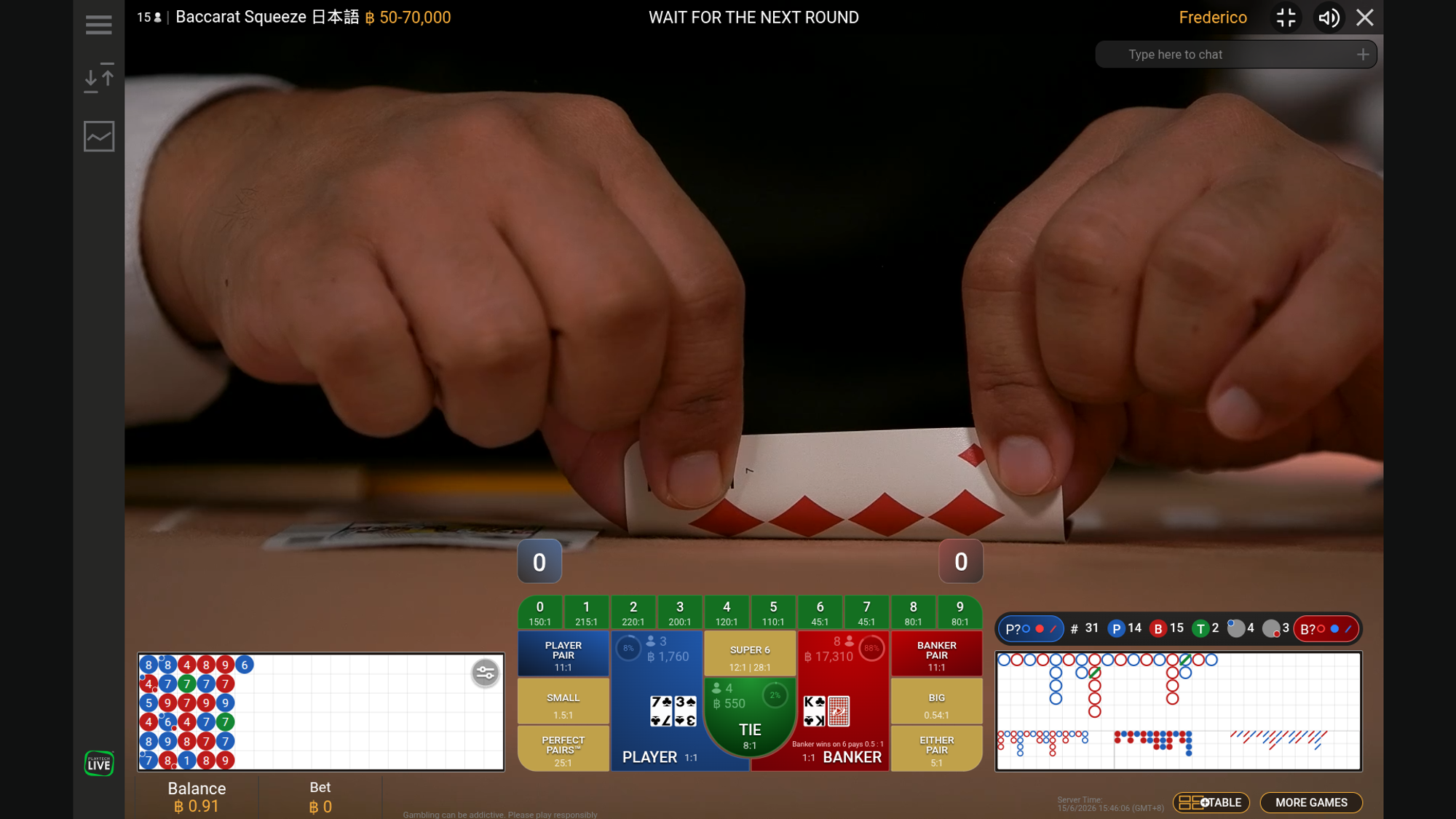 A live baccarat dealer performing the squeeze, slowly bending and revealing the edge of a card at a studio table