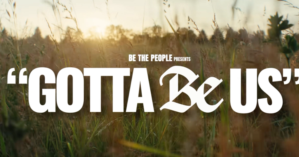 White text "BE THE PEOPLE PRESENTS GOTTA Be US" over a blurry field with tall grass and a sunset.