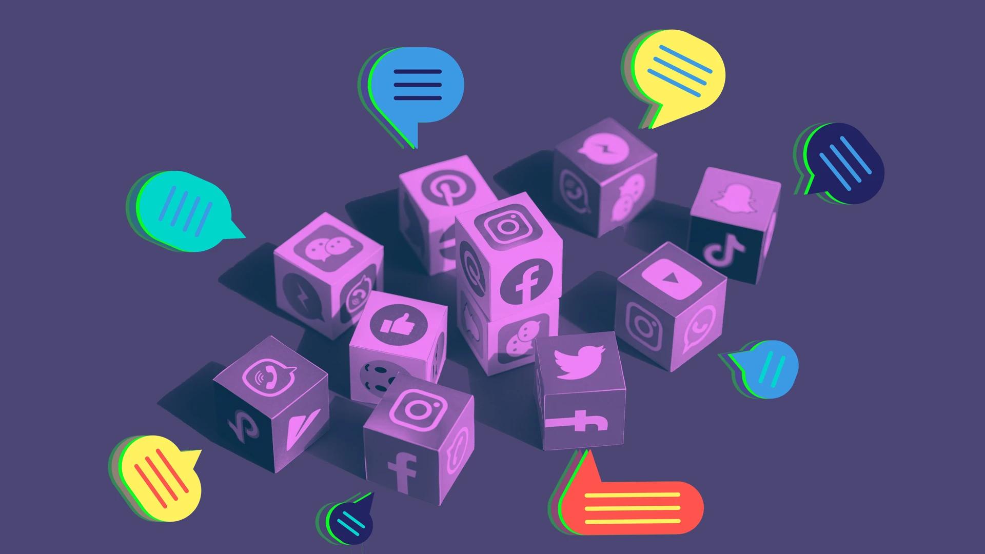 Isometric 3D purple cubes with social media logos and colorful chat bubbles on a dark background.