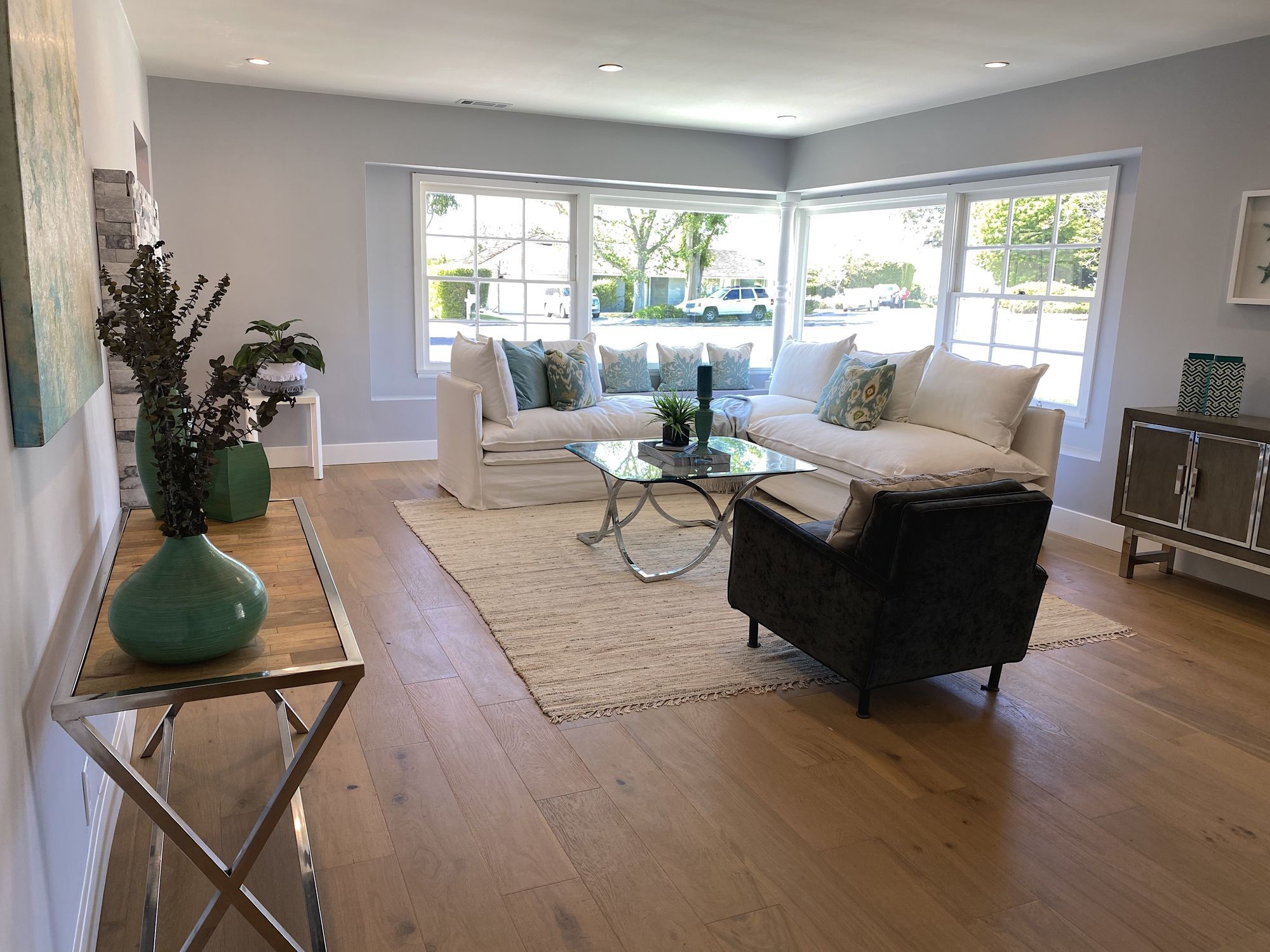 Coastal contemporary living room with light furnishings that complement the ocean views