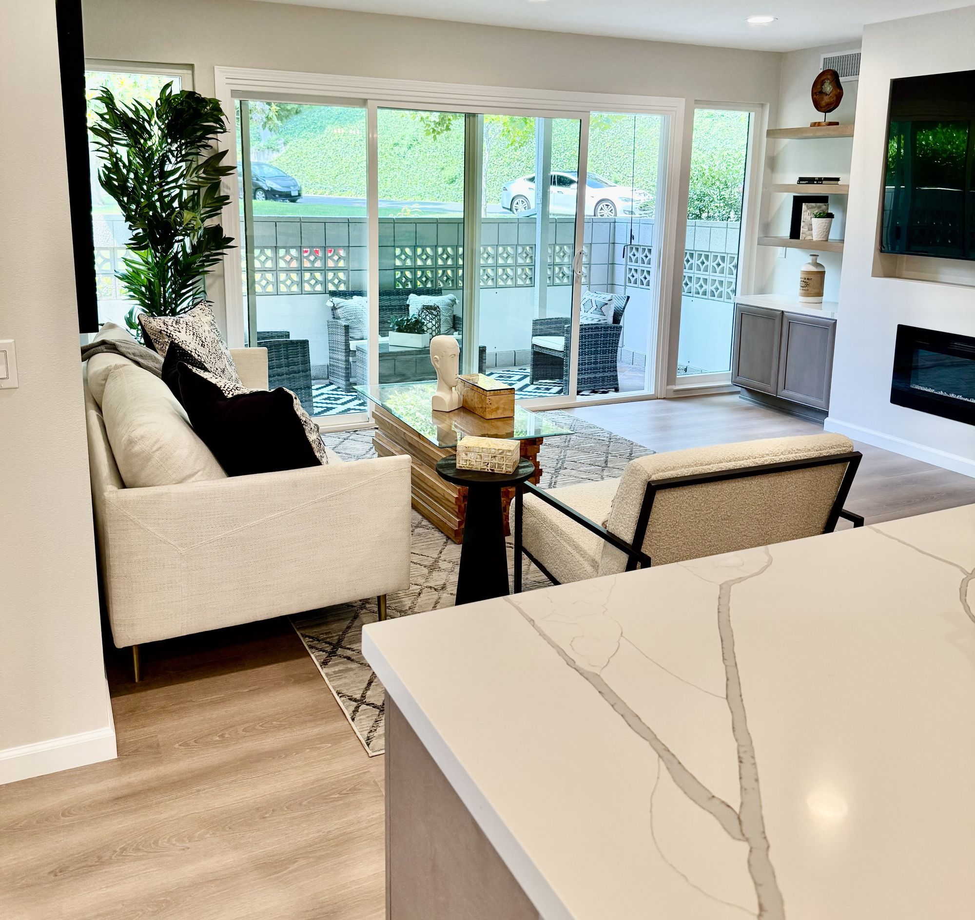 Staged condo living room with modern furniture and decor