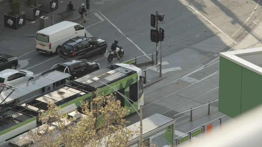 Aerial view of a city intersection with trams and traffic