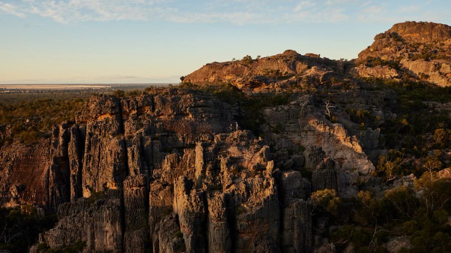 Rocky escarpment cliffs at sunset