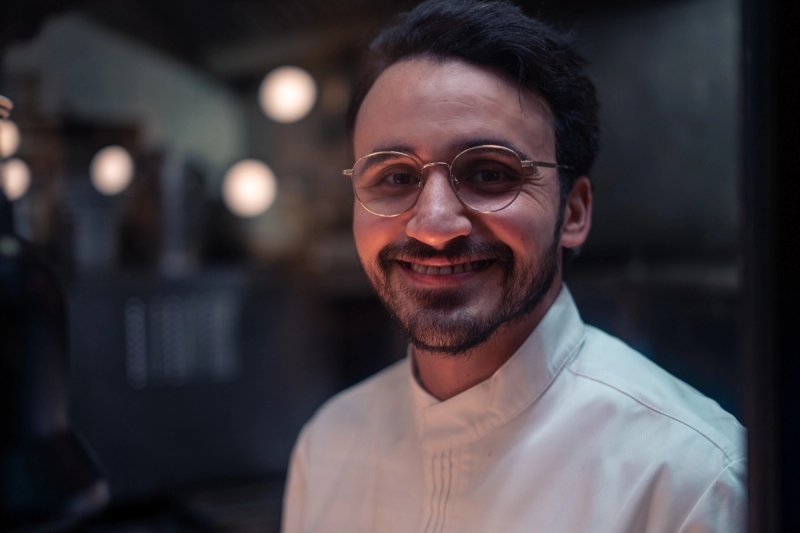 Chef portrait in restaurant kitchen artistic and professional