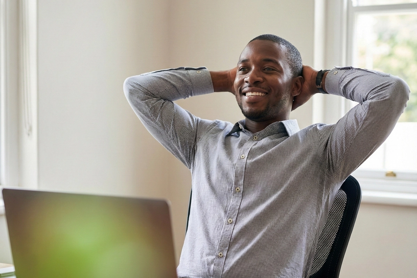 Happy man at his desk