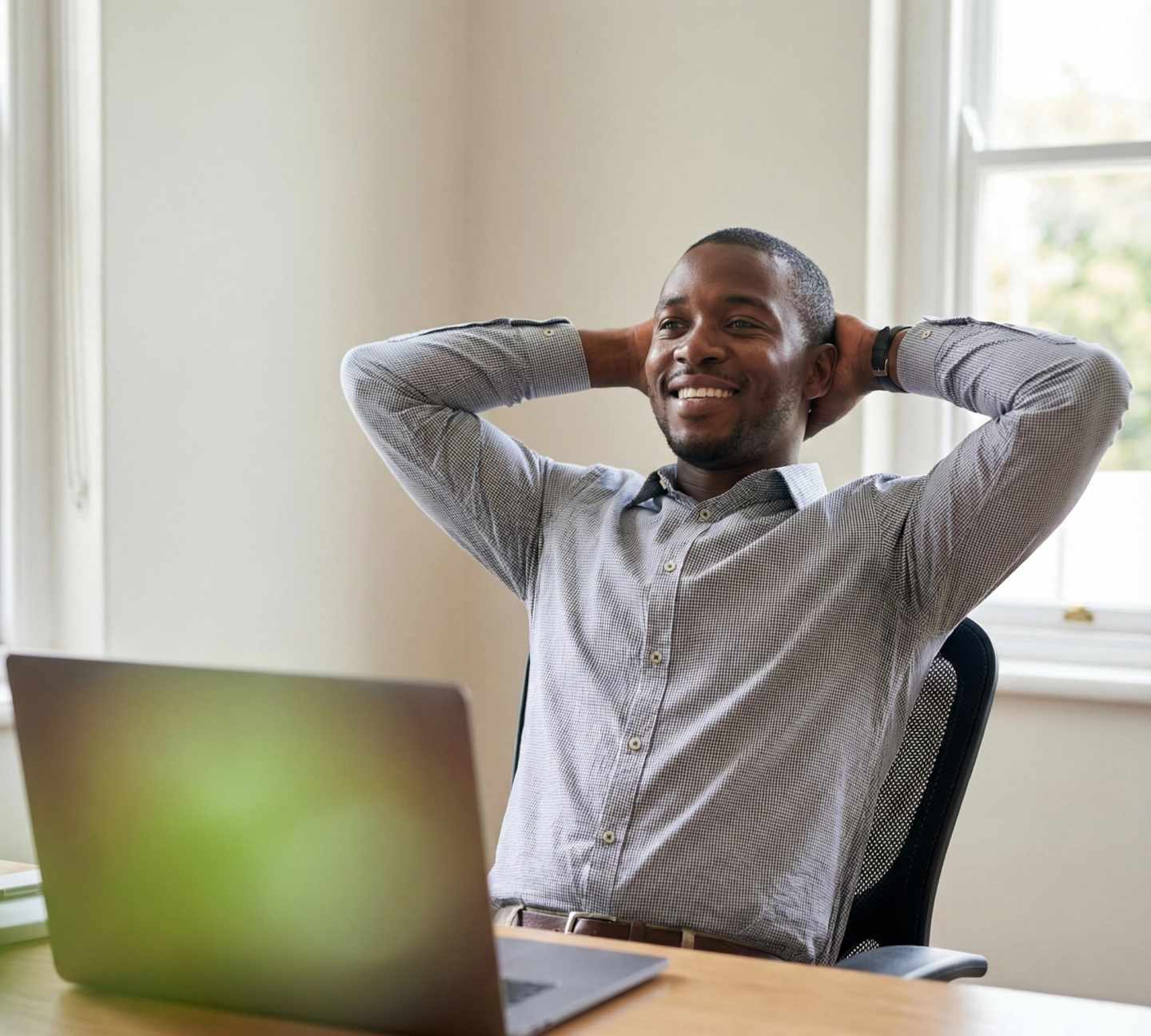 Happy man at his desk