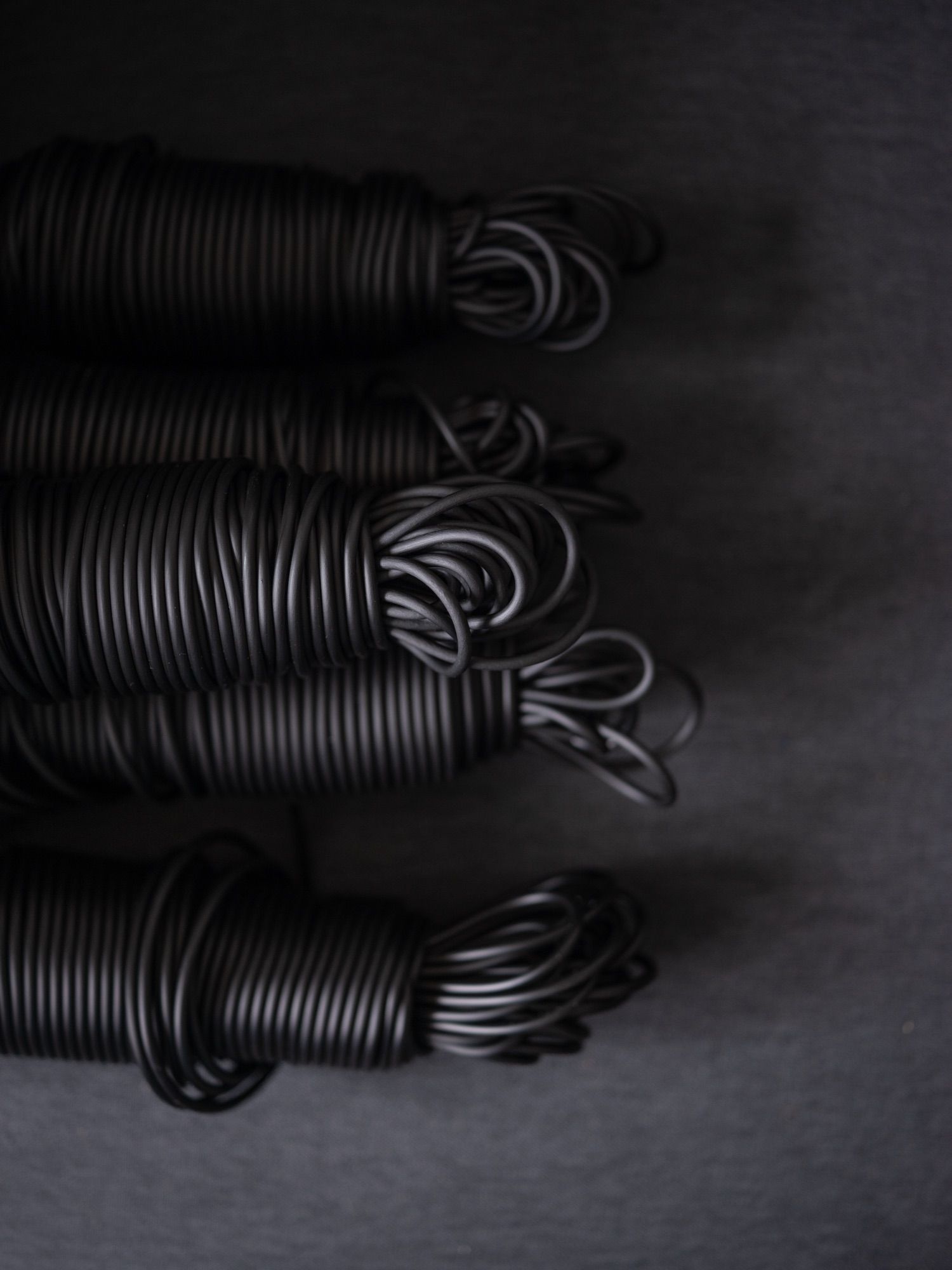 Coils of black PVC string.
