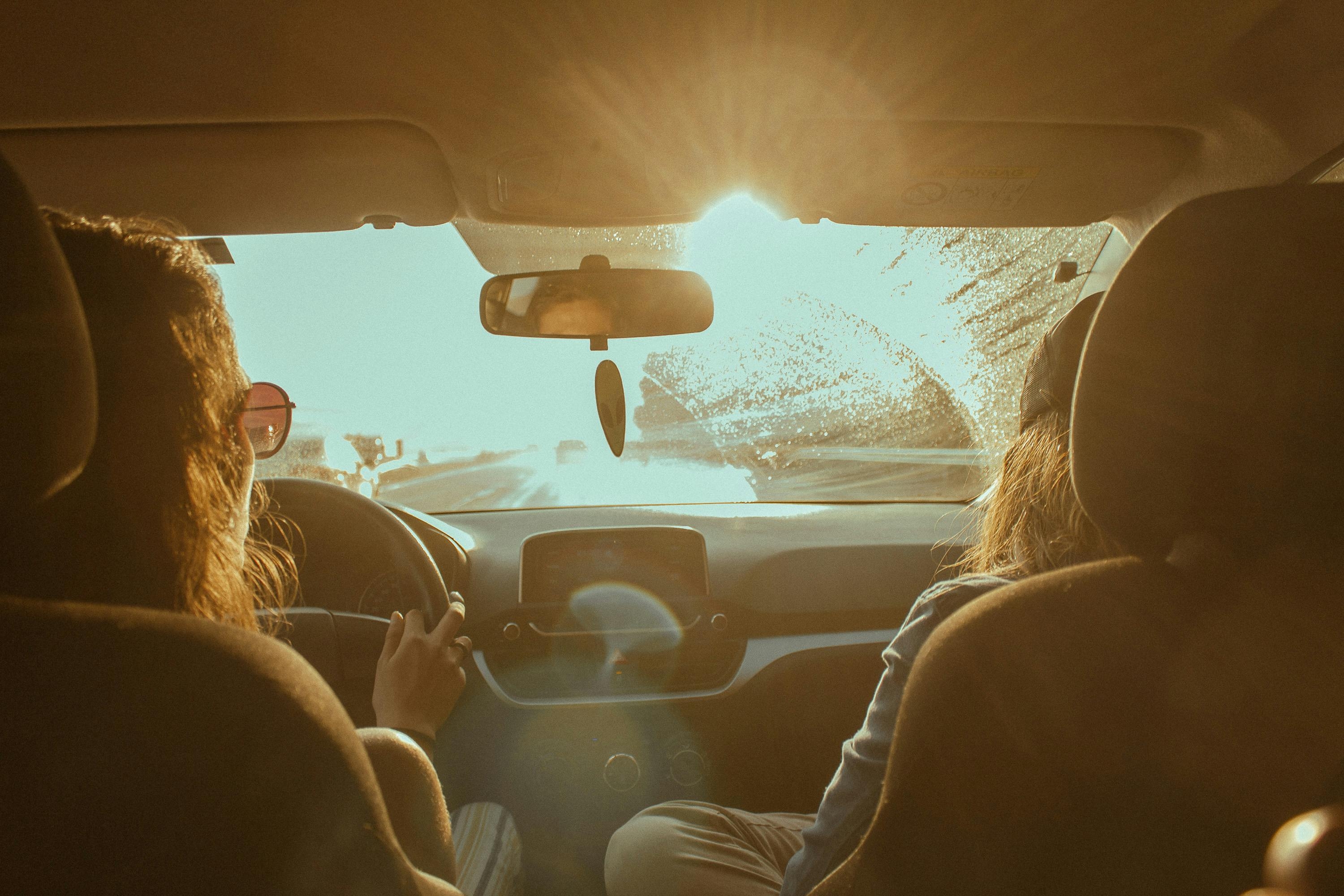 Image Bright sun glare through a car windshield shows why Jersey Shore drivers need to understand their options after an uninsured driver crash.