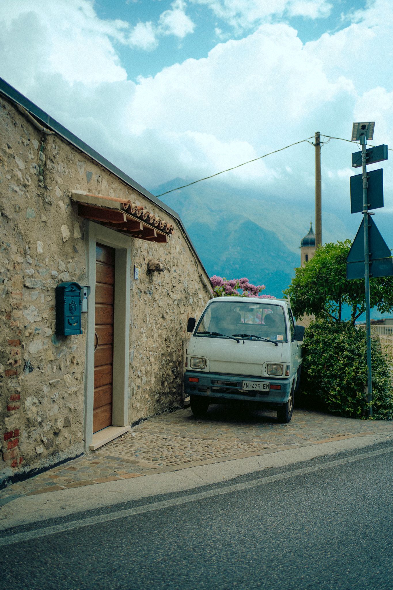 Small car in front of sea
