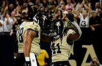 New Orleans Saints center Erik McCoy (78) and running back Alvin Kamara (41) celebrate a touchdown against the Arizona Cardinals.