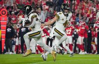 New Orleans Saints quarterback Derek Carr (4) hands off to running back Alvin Kamara (41) against the Kansas City Chiefs during the first half at GEHA Field at Arrowhead Stadium
