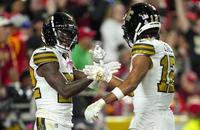 Saints wide receivers Rashid Shaheed (22) and Chris Olave (12)