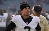 New Orleans Saints quarterback Spencer Rattler walks off the field following a loss to the Chicago Bears.