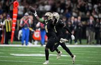 Saints cornerback Kool-Aid McKinstry (4) and teammate Alontae Taylor (1) celebrate after an interception by McKinstry against the New York Giants during Sunday's game.