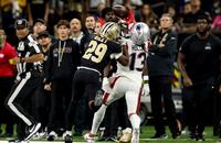 New Orleans Saints cornerback Quincy Riley defends a pass intended for New England Patriots receiver Mack Hollins.