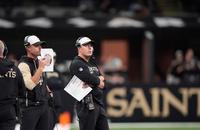 Saints head coach Kellen Moore watches from the sideline during a preseason game against the Denver Broncos.