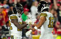 Saints receivers Chris Olave and Rashid Shaheed after a Shaheed touchdown in Kansas City last season.