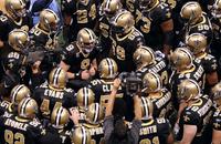 New Orleans Saints quarterback Drew Brees (9) huddles with his teammates before the start of their game against the Seattle Seahawks.